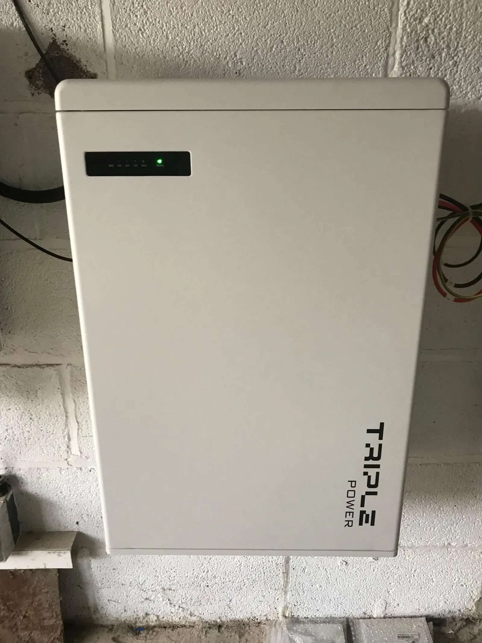 Close-up of a single Solax Triple Power battery module showing its status light